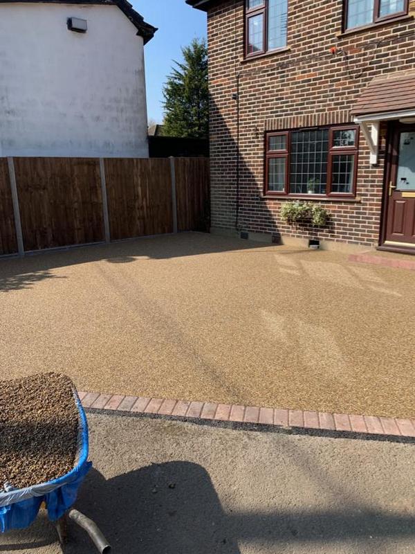 in process of surfacing front yard with resin bound material