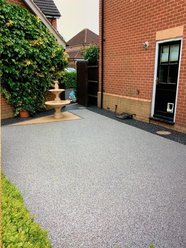 resin surfacing for driveway and front of the house