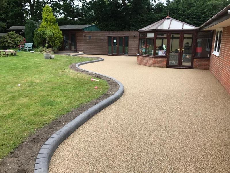 resin surface at the exterior of the house next to garden
